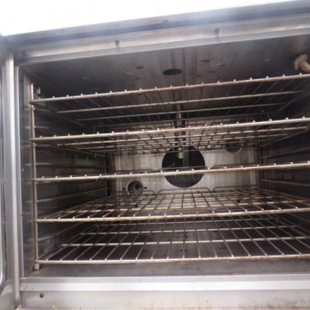 American Range M-2-G1 natural gas double stack convection oven, interior view with multiple racks, used condition.
