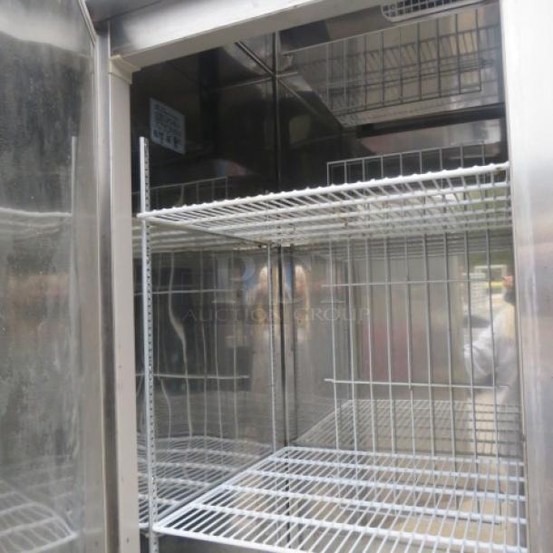 Superior 2-door refrigerator, Model R49-S, with 4 wire racks on casters. Measures 55x31x83.5 inches. 11 Volt.