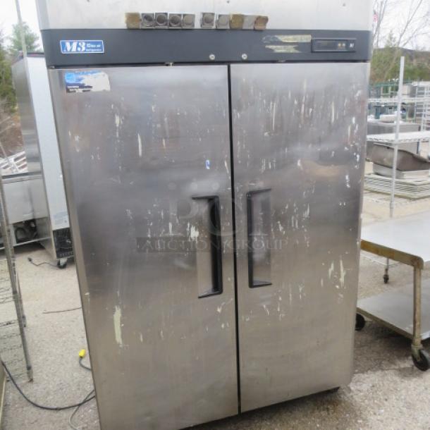 Turbo Air 2 Door Refrigerator, Model M3R47-2, with 3 racks on casters. Visible wear, dimensions 51x30.5x82 inches.