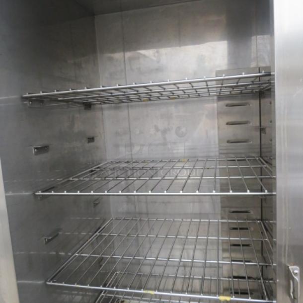 Plate Mate Heated Holding Cabinet HM84-W1, stainless steel interior, three wire shelves, on casters, 36x30x76 inches.