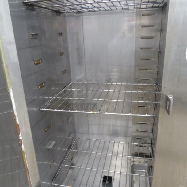 Plate Mate HM84-W1 heated holding cabinet, stainless steel, 1 door, on casters, 36x30x76, 120V, interior shelving visible.