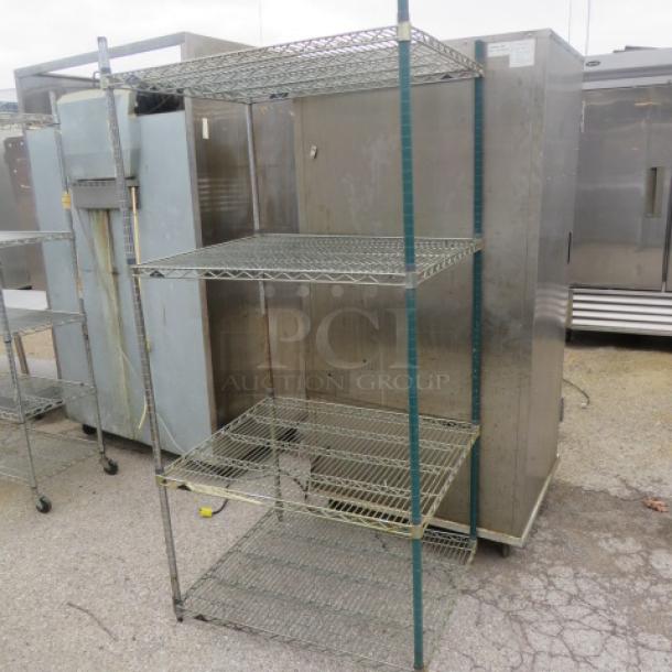 Metro metal shelf unit with 4 tiers, 35x30x75 inches. Features wire construction, sturdy frame. Used condition.