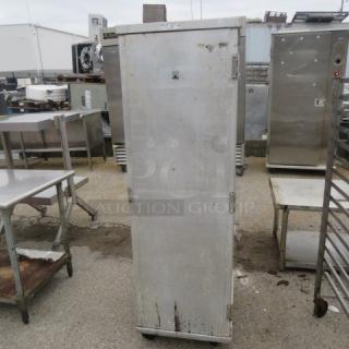 Winholt aluminum 1-door holding cabinet on casters, 20x26.5x67.5 inches. Used condition with visible wear. Ideal for storage.