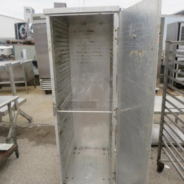 Winholt aluminum holding cabinet, 1 door, on casters, 20x26.5x67.5 inches, visible wear, spacious interior with shelving slots.