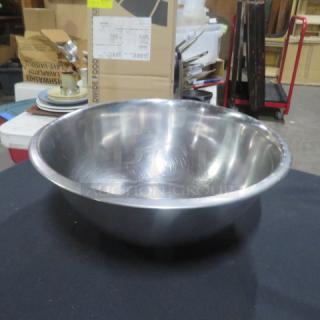 13.5-inch stainless steel mixing bowl, gently used, with a smooth, shiny finish and minor surface scratches.