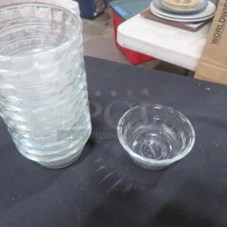 Glass ramekin, clear, with stack of similar bowls. Lightly used, featuring ribbed texture. Model: 12XBID.