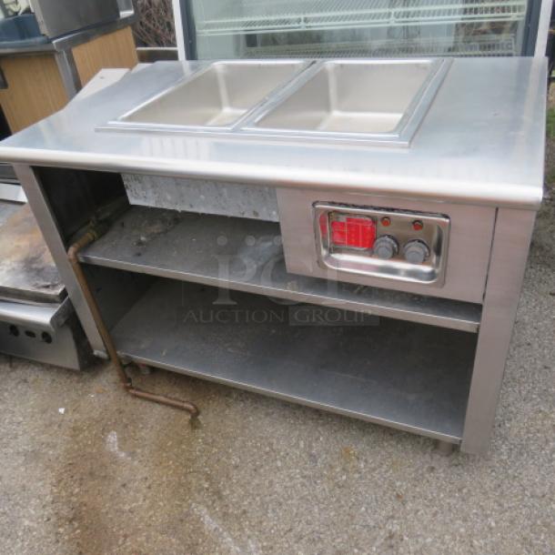 Stainless steel One 2 Well steam table with SS under shelf, 48x30x35 inches; features dual compartments and control panel.