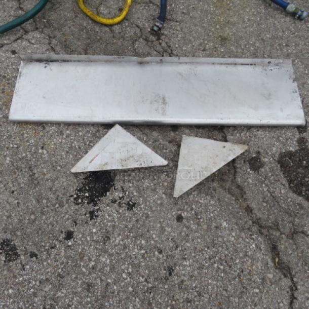 Stainless steel wall mount shelf with brackets, 48x12x12 inches, moderate wear, suitable for kitchen or garage use.