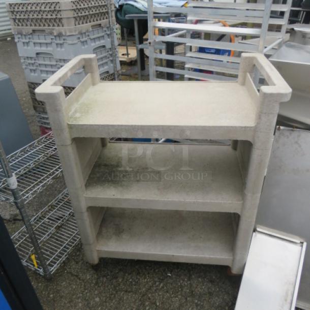 Rubbermaid 3-shelf cart on casters, 31x18x37 inches. Light wear visible. Durable plastic, ideal for storage and transport.