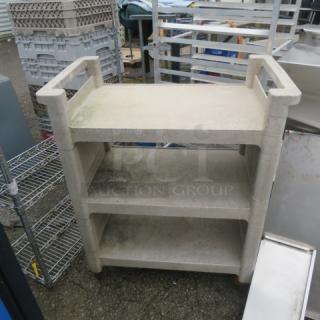 Rubbermaid 3-shelf cart on casters, 31x18x37 inches. Light wear visible. Durable plastic, ideal for storage and transport.