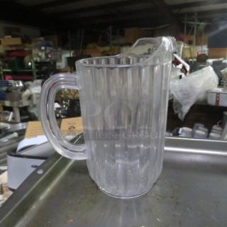 Clear polycarbonate pitcher with ribbed design and pouring spout. Model: 3XBID. Excellent condition.