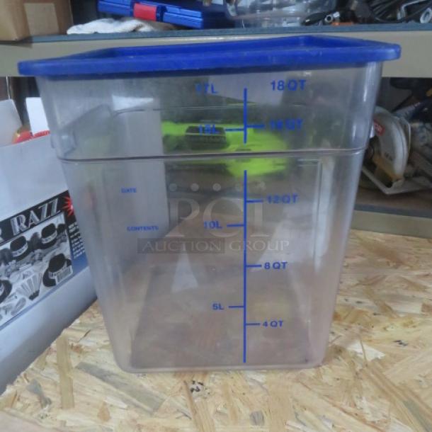 18-quart food storage container with blue lid. Clear plastic with marked measurements. Good condition.