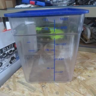 18-quart food storage container with blue lid. Clear plastic with marked measurements. Good condition.