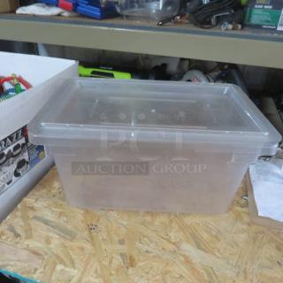 Transparent 5-gallon food storage container with lid, excellent condition, ideal for bulk storage.