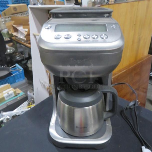 Breeville Grind and Brew Coffee Maker, Model BDC600XL/A, features stainless steel pot, digital controls, like-new condition.