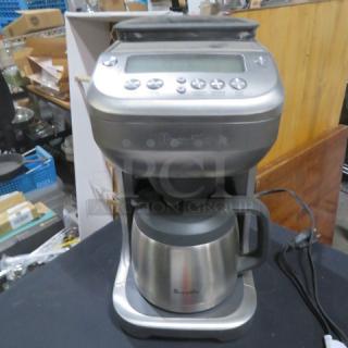 Breeville Grind and Brew Coffee Maker, Model BDC600XL/A, features stainless steel pot, digital controls, like-new condition.