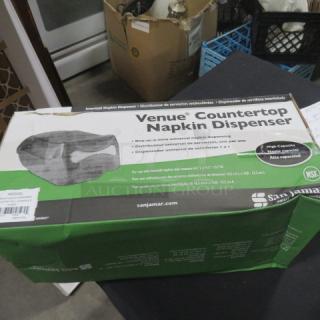 San Jamar Venue Countertop Napkin Dispenser, new in box. High capacity, NSF certified. Box shows product image and branding.