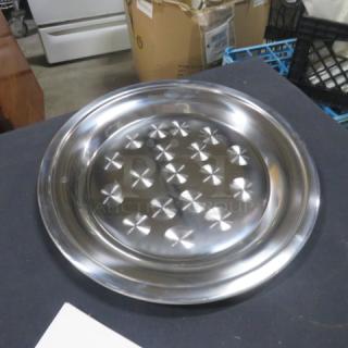 12-inch stainless steel cater tray, new condition, with decorative pattern. Ideal for serving. Marked "2XBID."