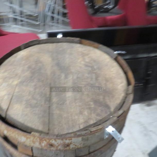 Wooden whiskey barrel with top, measures 41x40 inches, rustic condition, visible metal bands.