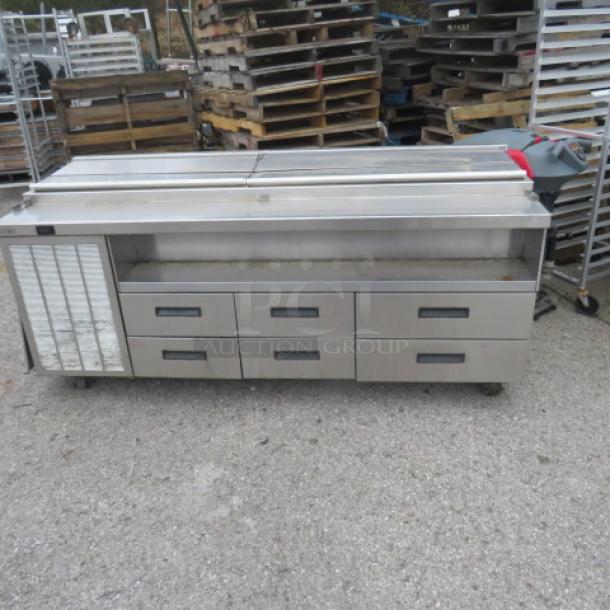 Delfield F18SC85 refrigerated prep table, 6 drawers, stainless steel, on casters, 83x31x38 inches, 115V, good condition.