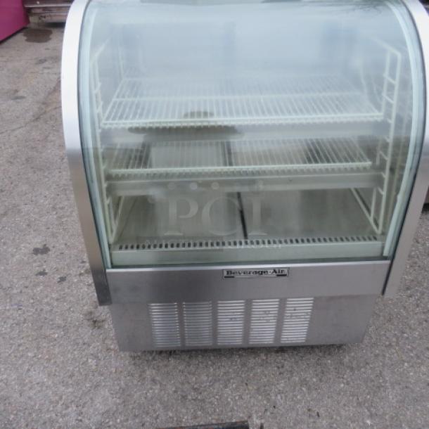 Beverage Air CDR3-1 curved glass refrigerated display case, 3 shelves, on casters, 115V, dimensions 37.5x34x50 inches.
