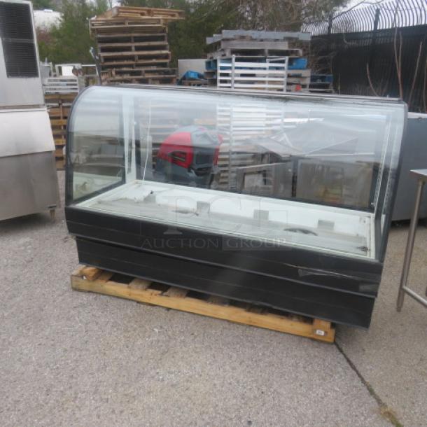Federal Curved Glass Display Case, Model CGR7748, 120 Volt, 77x34x48.5 inches. Good condition on a wooden pallet.
