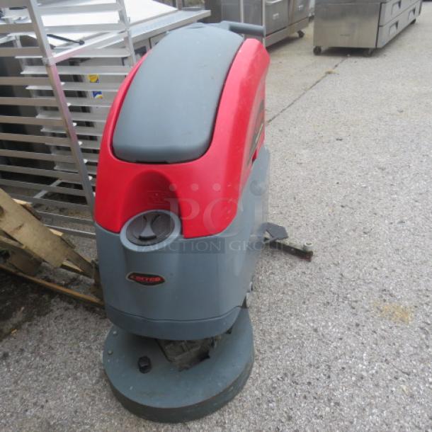 Betco Stealth Carpet Cleaner ASD20B, red and gray, used condition, visible Betco logo, industrial-grade cleaning equipment.