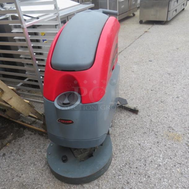 Betco Stealth Carpet Cleaner ASD20B, red and gray, used condition, visible Betco logo, cleaning pad attachment.