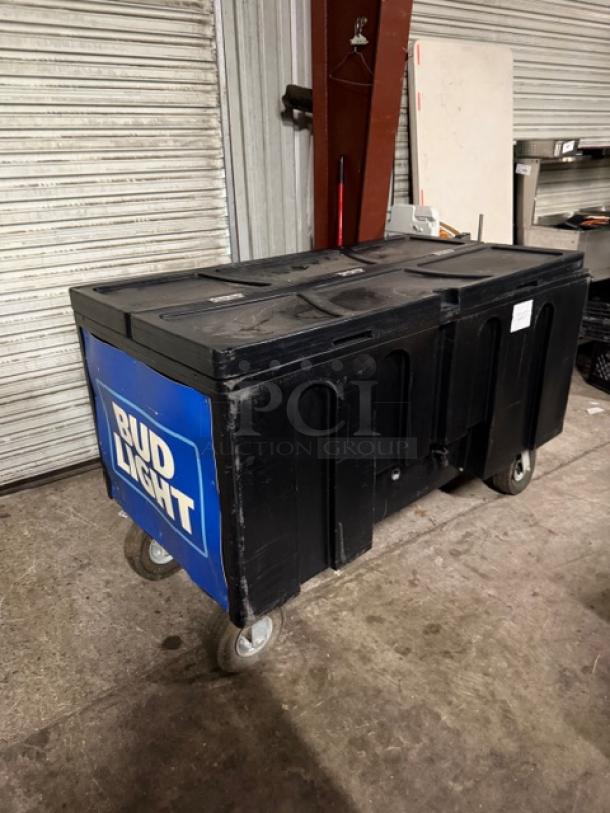 Arctic Model IRP-1030 mobile beverage cart, black, 60x31x36 inches, on casters, side handles, "Bud Light" logo, indoor/outdoor use.