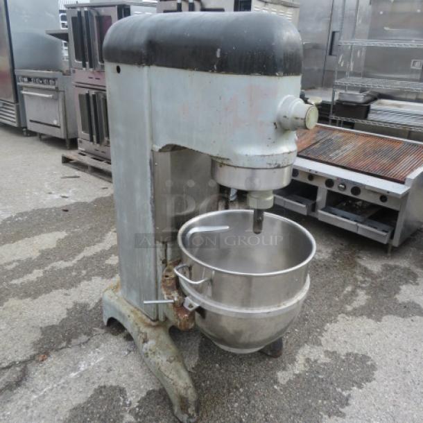 Hobart H-600T 60-quart stand mixer with stainless steel bowl and hook, 208V, 3-phase. Shows signs of wear, used condition.