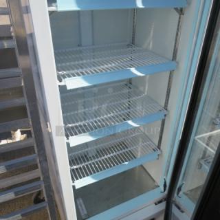 Avantco 1 Door Glass Display Cooler, Model 178GDC10HCW, with 4 shelves. Measures 22x22x63 inches. 115 Volt. In working condition.