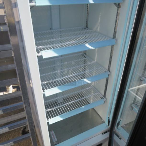 Avantco glass display cooler model 178GDC10HCW with 4 adjustable shelves, 22x22x63 inches. Excellent working condition.