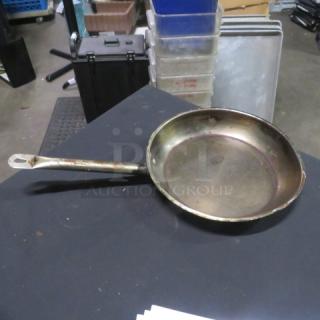 Stainless steel 12-inch sauté pan, well-used condition, visible wear and tarnish, sturdy handle, suitable for restoration.