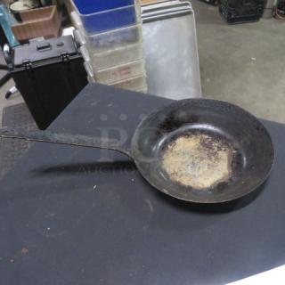11-inch saute pan with long handle, pre-owned with visible wear and rust. No visible brand or model markings.