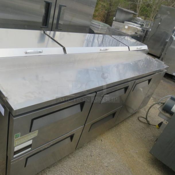 Turbo Air refrigerated prep table, model TPR-93SD-DS, features one door, four drawers, and stainless steel construction. Dimensions: 93.5x36x44 inches.