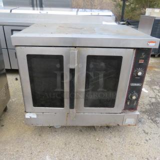 Hobart natural gas convection oven with 3 racks, model 40X31X31. Used, operational condition, slight wear on exterior.