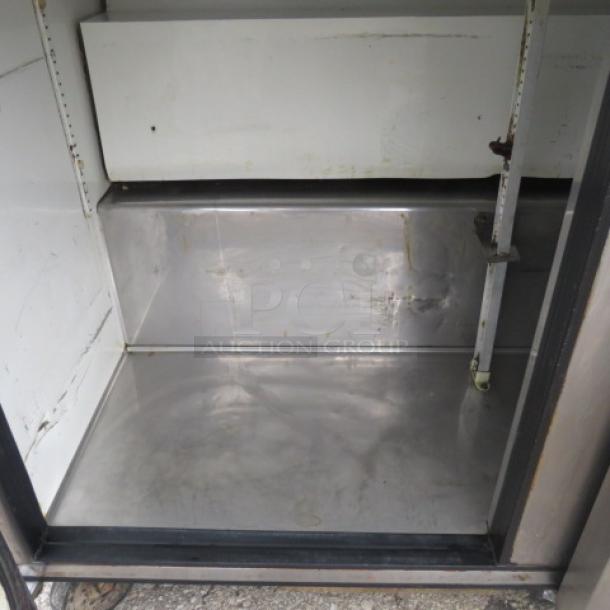 True 3 Door Refrigerated Prep Table, Model TSSU-72-30M-B-ST, 115V, stainless interior, on casters, size 72x34x48.