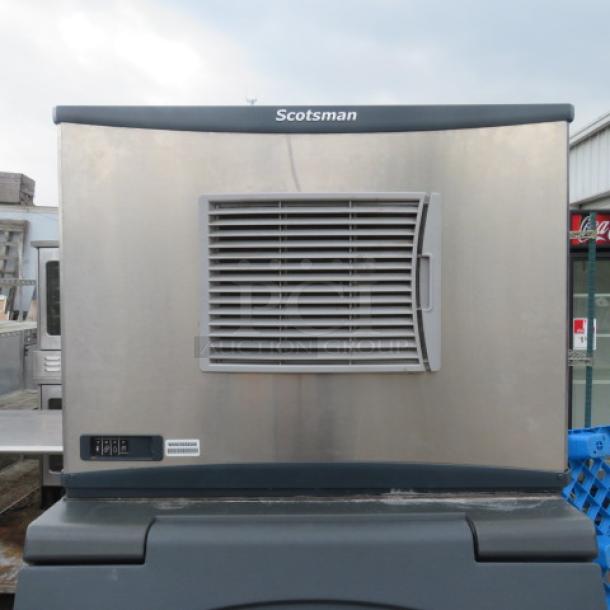 Scotsman Ice Maker, Model CO33OSA-1E, 115V, dimensions 30.5"x24.5"x23". Stainless steel, visible brand logo and control panel.