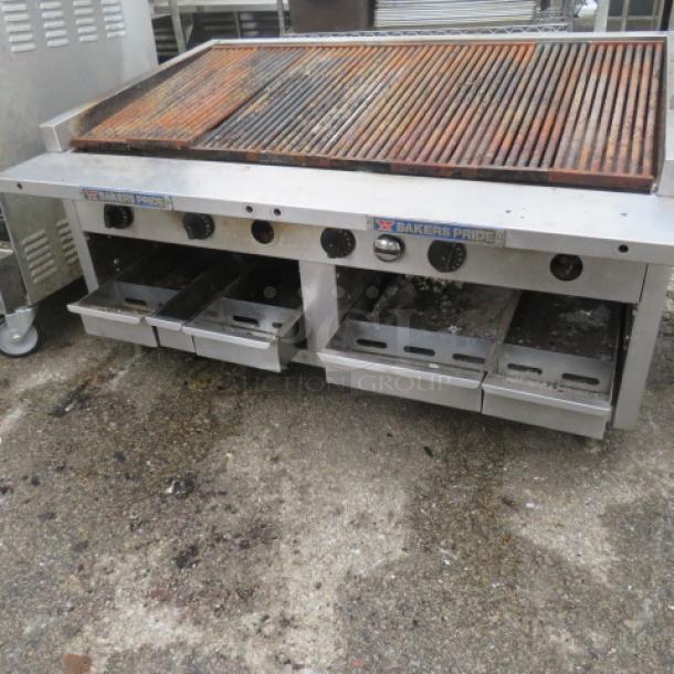 Bakers Pride natural gas charbroiler, 48x34x26 inches, used condition; features dual control knobs and drip trays.