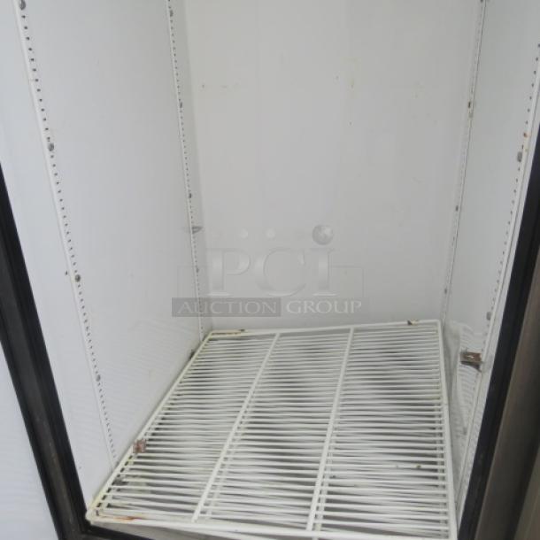 True T-49DT combo refrigerator/freezer interior, 6 racks, 54x29.5x83 inches, on casters, 115V, in used condition.