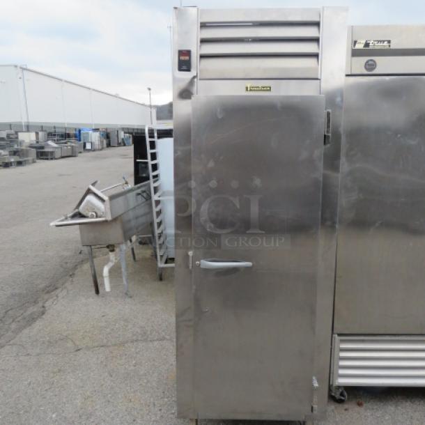 Traulsen 1 Door Refrigerator, Model RCV132WUT-FHS, with 2 racks, 30x34x83 inches, stainless steel, used condition.