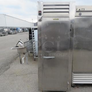 Traulsen 1 Door Refrigerator, Model RCV132WUT-FHS, with 2 racks, 30x34x83 inches, stainless steel, used condition.