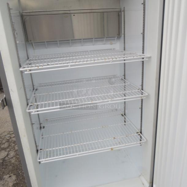 Kelvinator 1 Door SS Refrigerator, Model KCBM180RQYA, with 3 racks, on casters, dimensions 32x27x74.5 inches, 115 Volt.