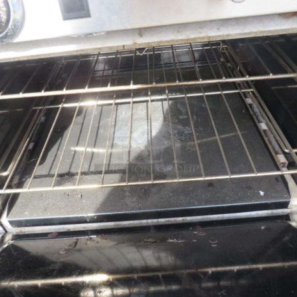 Southbend S60DD gas range interior, showing oven racks and bottom surface; condition appears used.