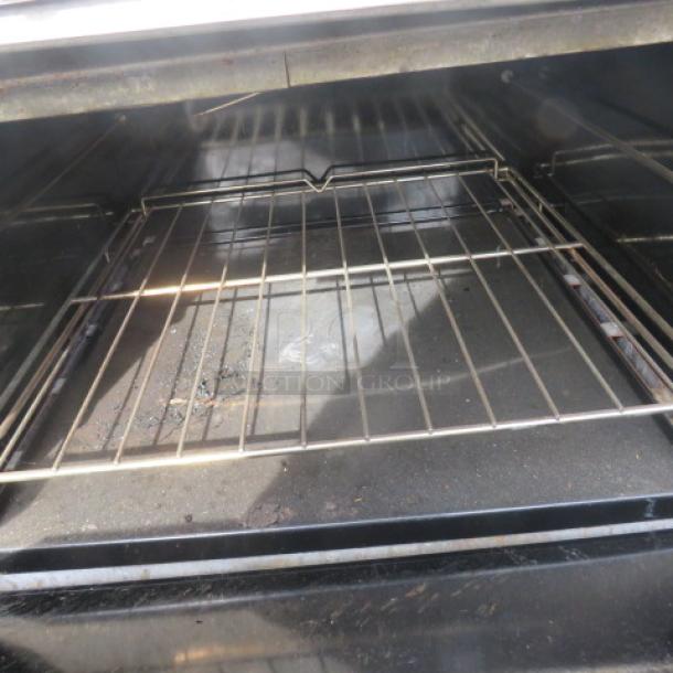 Southbend Model S60DD interior oven view, showing metal racks and slight wear, part of a 10-burner range with SS over shelf.