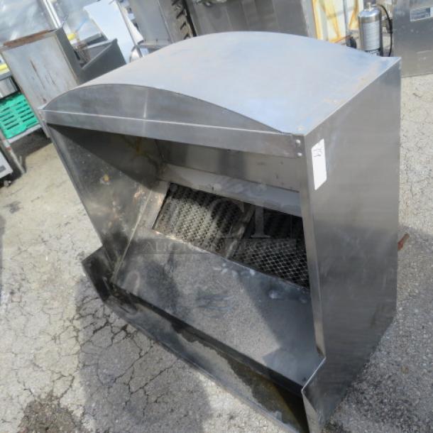 Stainless steel hood system, commercial-grade, used condition, featuring vent filters and robust construction.