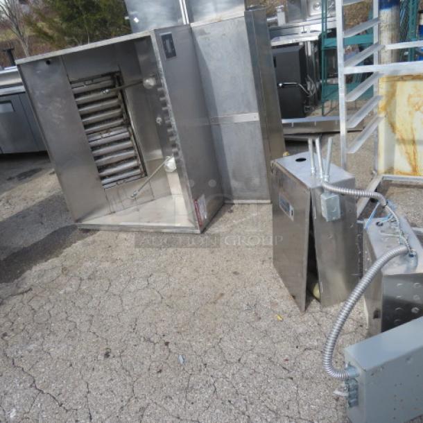 One Captive Air stainless steel hood system with return air and Ansul; visible wear; includes control box and piping.