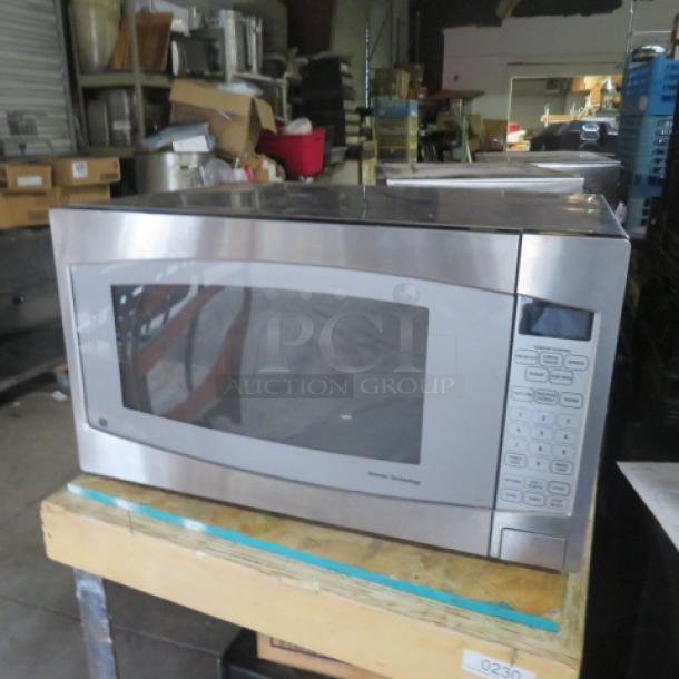 GE Inverter Tech Microwave Model JES2251SJ03, 24x18x14, stainless steel, no glass, keypad intact, used condition.