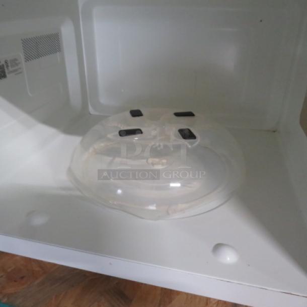 GE Inverter Tech Microwave, Model JES2251SJ03, 24x18x14, no glass plate, white interior, visible interior labels.