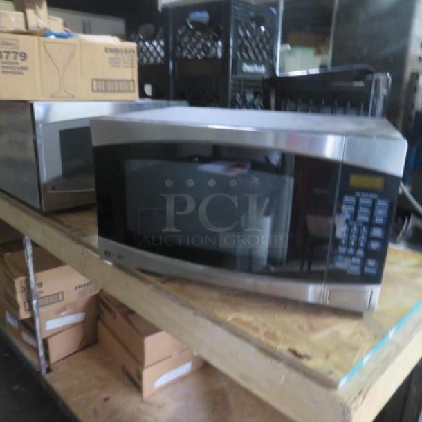 GE Profile Microwave, Model PEB2060SM1SS, 120V, stainless steel, 24x18x13.5 inches, visible control panel and door handle.